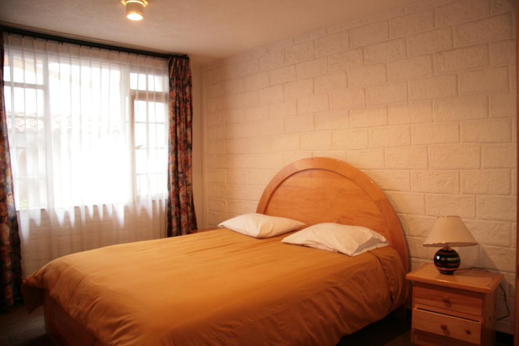 Apartamentos Los Quipus Quito Szoba fotó